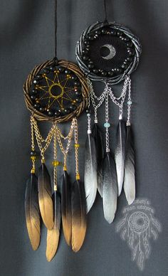 an assortment of dream catchers hanging on a wall