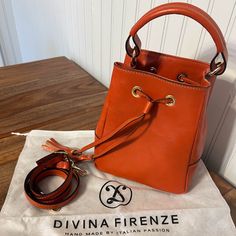 Beautiful Orange Italian Leather Bag With Crossbody Strap. Drawstring Closure With One Interior Pocket. Only Used Twice. New Condition With Dust Bag. Italian Leather Bags, Italian Leather, Leather Bag, Dust Bag, Bag Lady, Orange, Leather, Women Shopping, Color