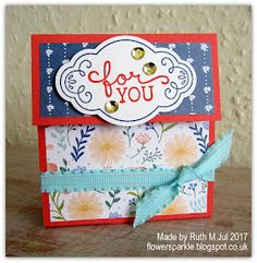 a close up of a card with flowers on it and the words for you written in red, white, and blue