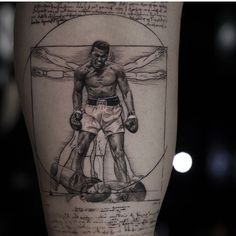 a man's leg with a drawing on it and the image of a boxer