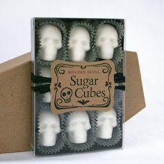 a box of sugar cubes with skulls in the middle and one skull on each side