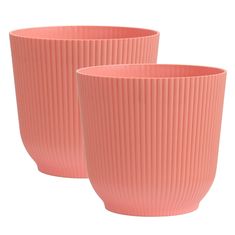 two pink cups sitting next to each other