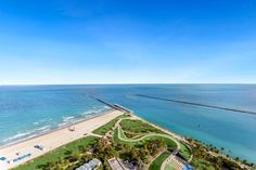 an aerial view of the beach and ocean