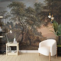 a room with a painting on the wall and a white chair in front of it