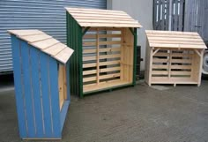 two wooden sheds sitting next to each other