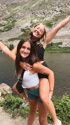 two young women are posing for the camera with their arms around each other and smiling