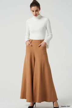 "This fashion brown wide leg pants is designer from XIAOLIZI. The long wool pants made high waisted + back zipper closure + front two up entry pockets + many front pleated add to the wide leg cut of our maxi pant, makes the warm pants more fashionable and warm in winter, it's elegant and classic womens pants, come on! Your wardrobe should have it. DETAIL * Made from Wool fabric, polyester lining * back zipper closure * two up entry pockets * winter pant, warm pant, long pants, maxi pants CUSTOM Wide Leg Wool Dress Pants For Fall, Beige Wide Leg Wool Pants, Fitted Wool Wide Leg Pants For Fall, Wide Leg Beige Wool Pants, High-waisted Wool Pants For Fall, Fall High-waisted Wool Pants, Beige Wool Wide Leg Pants, Chic Wool Bottoms For Fall, Beige Wide Leg Dress Pants