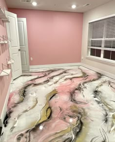 a room with pink walls and marble flooring that looks like it has been painted