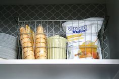 some food is in a wire basket on the shelf