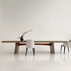 a table with two chairs and a bird on it