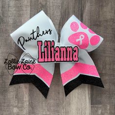 New Pink Out Design!! White grosgrain ribbon with neon pink and black glitter vinyl. This bow also has a 3D center with your choice of name. This bow is designed with glitter vinyl HTV and a personalized center on 3" high quality grosgrain ribbon. Comes on your choice of lined clip or pony. All Lollie Laine Bow Co bows are hand crafted  using USA made high quality three inch grosgrain ribbon.  Bows are heat sealed to prevent fraying and sprayed to keep the shape. The spray will wear off with use.  You can find examples of the sizing in the pictures.  Cheer Sizing: 6" x 6" PLEASE MESSAGE ME FOR ORDERS MORE THAN 4 BOWS. Ribbon color choices can be found in the pictures.  Turn around time can be found here: https://www.etsy.com/shop/LollieLaineBowCo?ref=seller-platform-mcnav  Business days ar Pink Out Cheer Bows, Pink Out Cheer, Pink Cheer Bows, Volleyball Cheers, Cheer Season, Team Cheer, Cheerleading Bow, Cheer Hair Bows, Cheer Ideas