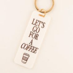 a keychain that says, let's go for a coffee