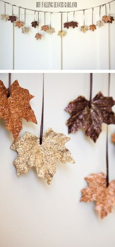 some leaves are hanging from a string on the wall and one is made out of glitter