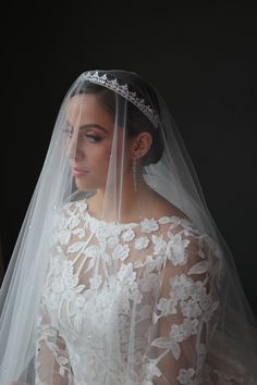 a woman in a wedding dress and veil