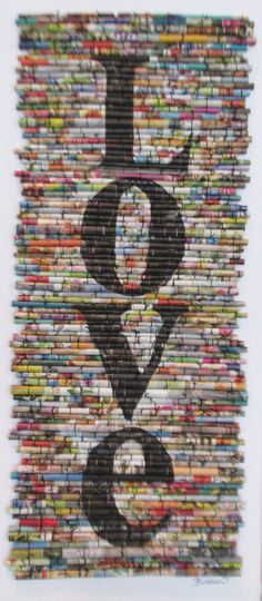 an art piece made out of magazines with the letter q in it's center