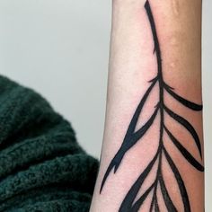 a close up of a person's arm with a tattoo design on the wrist