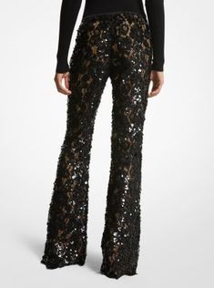 Intricately tailored in floral lace with nude silk lining these trousers are an ultra-romantic upgrade to basic flares. Featuring elaborate paillette hand-embroidery they’re designed with a concealed side-zip fastening and scalloped hem. Wear yours with a coordinating tunic or a shoulder-baring blouse. Party Lace Wide Leg Pants, Spring Evening Lace Bottoms, Party Wide Leg Lace Pants, Wide Leg Lace Pants For Party, Elegant Lace Party Bottoms, Lace Wide Leg Party Bottoms, Spring Embellished Evening Bottoms, Wide Leg Lace Party Bottoms, Spring Evening Embellished Bottoms