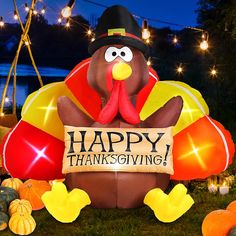 a large thanksgiving turkey with a happy thanksgiving sign