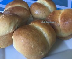 several rolls on a white plate ready to be eaten