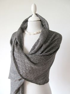 Luxurious scarf made of pure silk in grey - an accessory in a class of its own! The elegant ladies' scarf is knitted from pure natural fibre, it is a wonderful companion for festive occasions and also suitable as a high-quality stole for everyday wear. The shawl has a subtle pattern and curved edges on both ends. The Italian yarn is breathable and sustainable and provides a wonderful feeling on the skin - soft and scratch-free! In addition to its nobility, the scarf also scores with its beautifu Shoulder Scarf, Ladies Scarf, Subtle Pattern, Mild Shampoo, Natural Fibre, Elegant Ladies, Beautiful Drapes, Shawls And Wraps, Elegant Woman