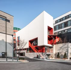 the building has red balconies on it's sides