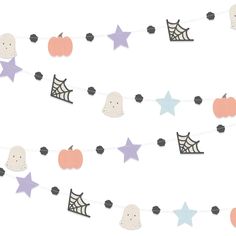 a halloween garland with paper stars, pumpkins and ghost hats on it's string