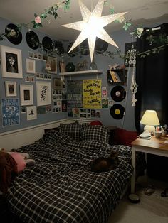 a bed room with a star hanging from the ceiling