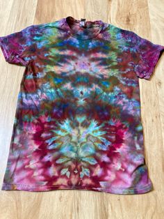 Lotus Tie Dye Shirt | Psychedelic T Shirt | Small Shirt | Galaxy Ice Dye Shirt | Festival Shirt | Mandala Psytrance Shirt | Geode Tie Dye https://fullspectrumdyes.etsy.com Handmade mandala lotus flower tie dye shirt containing vibrant colors with intricate patterns and immense depth Multicolor Pre-shrunk Graphic Tee, Fitted Rainbow Print Short Sleeve Top, Bohemian Multicolor Print Short Sleeve T-shirt, Fitted Rainbow Short Sleeve Tops, Multicolor Short Sleeve T-shirt For Festivals, Short Sleeve T-shirt With Sublimation Print For Festival, Colorful Bohemian Short Sleeve Tops, Multicolor Bohemian Relaxed Fit T-shirt, Bohemian Red Cotton T-shirt