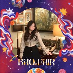 a woman standing in front of a poster with the words baq fair on it