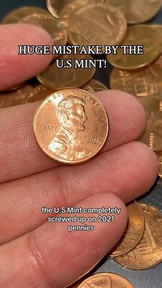 a hand holding a coin with the words, huge money by the u s mint