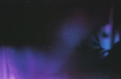 a blurry image of purple and blue lights