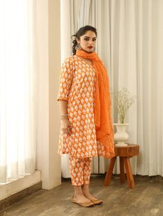 Beautiful handcrafted straight kurta pants set in pure cotton with lovely matching cotton doriya dupatta that is rightly finished with mirror embroidery. Color: Orange Fabric: Cotton and Kota Doria Note: Length and sizes can be customised Length - Kurta 40 inches Pants 38 inches Available in other colors If you happen to see some deformity in hand-work or fabric, that’s mere the technique of the same and not a defect. The garment is quite premium. The product will be delivered within 20-25 days Orange Chikankari Embroidery Palazzo Set For Diwali, Diwali Orange Chikankari Embroidery Palazzo Set, Navratri Orange Chikankari Palazzo Set, Traditional Drape Cotton Palazzo Set, Orange Anarkali Set With Chikankari Embroidery, Unstitched Orange Kurta With Gota Work, Straight Kurta Salwar Kameez With Block Print For Diwali, Block Print Lawn Suit With Straight Kurta For Navratri, Mulmul Kurta With Dupatta For Diwali