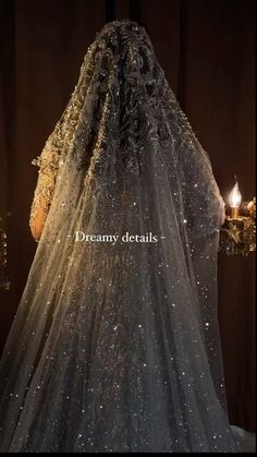 the back of a wedding dress with sparkles on it