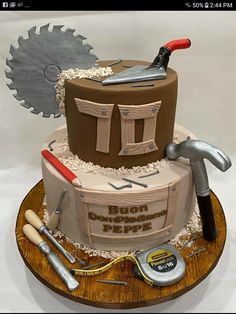 a birthday cake made to look like a construction site with tools on the top and around it