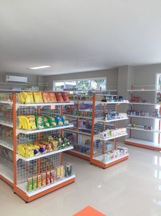 a grocery store filled with lots of food and drinks on shelves next to each other