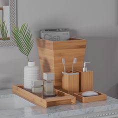 the bathroom accessories are neatly organized on the counter