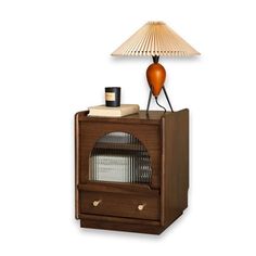 an old fashioned radio with a lamp on top