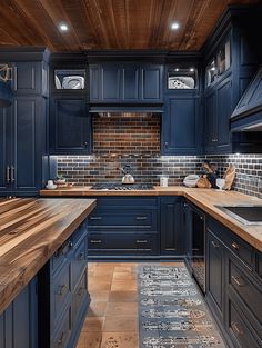 a kitchen with blue cabinets and wooden counter tops