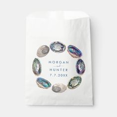 a paper bag with shells on the front and bottom that says, morgan and hunter