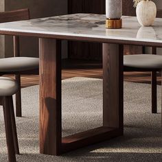 a marble top dining table with chairs around it