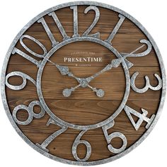 a wooden clock with metal numbers on it