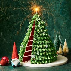 a christmas tree made out of green and red paper