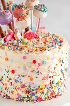 a birthday cake with sprinkles and candies on top