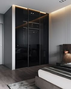 a bedroom with black and white walls, a bed and a closet in the corner