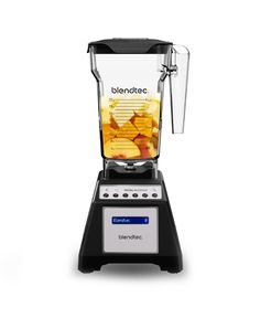 blender with food inside on white background