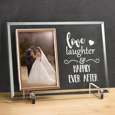 a wedding photo frame with the words love laughter and happily ever after