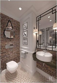 a bathroom with brick walls and white fixtures