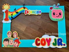 a wooden frame with cartoon characters and the word coy - r on it's side