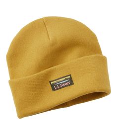 a yellow beanie hat with the label l l bean on it's side