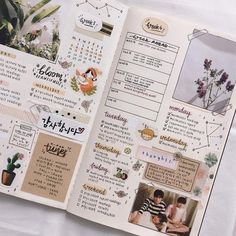 an open planner book with pictures and words on it's pages, including flowers